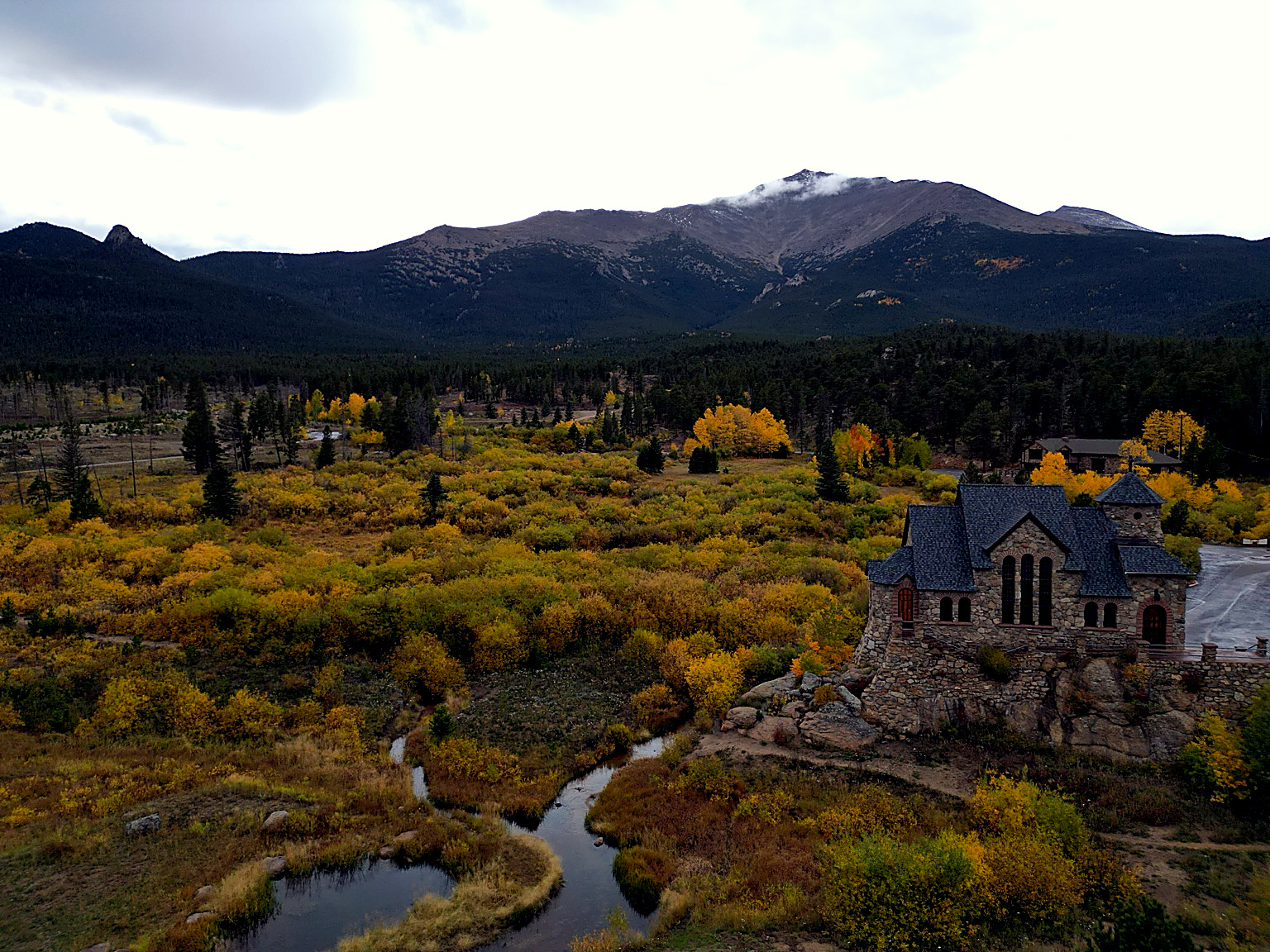 Aerial view of the Chapel on the Rock beneath Mount Meeker in autumn, Allenspark, Colorado